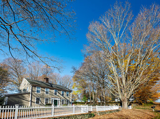 Connecticut autumn day at a colonial house with picket fence