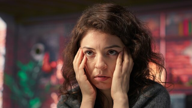 Businesswoman in a modern workplace types on a keyboard next to chroma key, using a creative agency office setup for digital media work. High tech workstation perfect for tasks. Camera A.