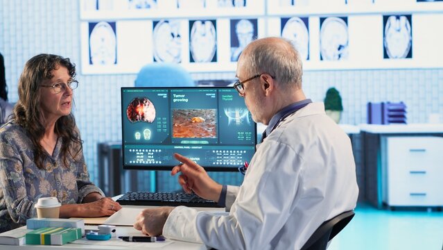 African american nurse measures fever on patient at checkup, offer assistance to the physician at the cabinet. Medical staff uses diagnostic tools and instruments, disease prevention. Camera B.