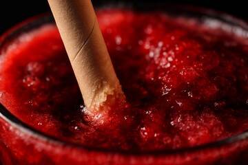 Refreshing summer drink with vibrant colors and creamy texture set against a dark background, perfect for hot days