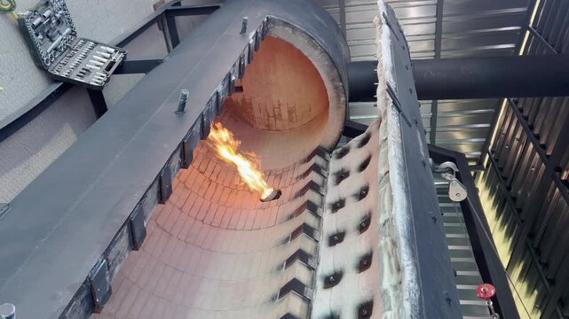 Cremator with internal thermal insulation layer of refractory brick, selective focus. Furnace designed for the thermal destruction of fallen cattle, poultry, and other organic waste
