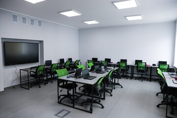 Computer science class with laptops at school
