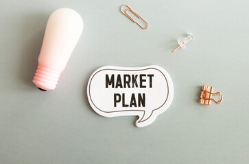 Marketing plan torn page on a notebook. calculator potted plant. words.