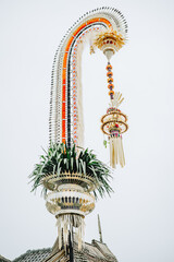 Traditional ceremonial decorative pole with hanging ornaments