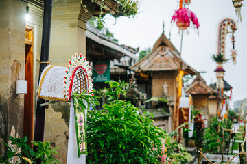 Traditional Balinese decoration with green leaves during rain