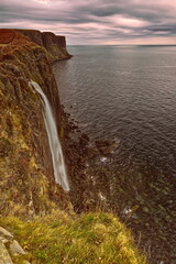 Fototapeta premium Loch Mealt falls, 55m plunge onto the seashore just south of the 90m Kilt Rock (Creag an Fhèilidh) wall facing Raasay Sound. Isle of Skye-Scotland-113