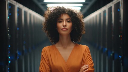 Visionary in Data Center: A woman, standing resolute in a high-tech data center, embodies confidence and expertise, signifying innovation and digital progress. - Powered by Adobe
