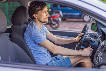 Man parking his car in an urban setting, carefully maneuvering in a tight space. Concept of driving, vehicle control, daily commute, safe parking, and modern lifestyle