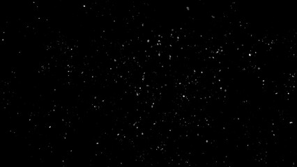 Winter freeze motion of white snow coming down, isolated on black background. Snowfall texture overlays.