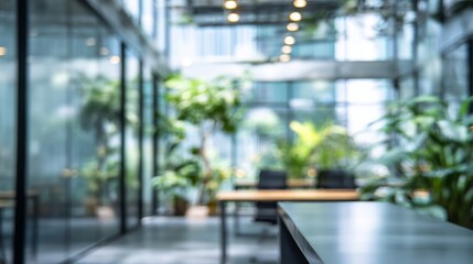 Abstract blurry office interior with modern design, glass walls, natural light, and greenery