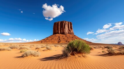 East Mitten Butte glows under the dusky sky of Monument Valley desert