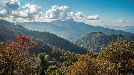 Fototapeta premium Lush green mountains and forested hills under a partly cloudy sky in a natural landscape