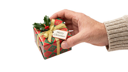 Hand holding Christmas gift box with ribbon and Merry Christmas tag isolated on transparent background