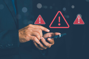 System warning alert on a virtual interface with hand interaction, showing cybersecurity risks, data breaches, malware threats, hacking attempts, and digital system vulnerability in modern technology.