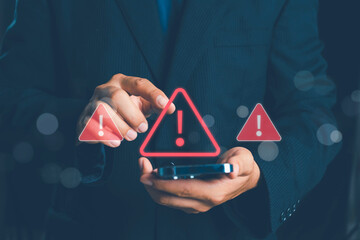 System warning alert on a virtual interface with hand interaction, showing cybersecurity risks, data breaches, malware threats, hacking attempts, and digital system vulnerability in modern technology.