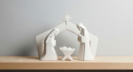Simple white ceramic holy family nativity scene on wooden shelf, representing the birth of Jesus and Christmas celebration for holiday decor.