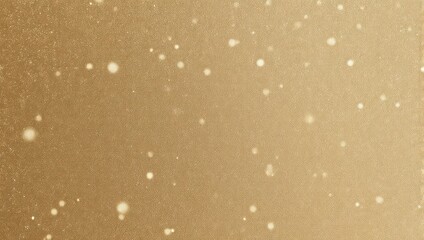 Warm gold gradient background speckled with bright, out-of-focus, glowing white particles