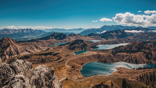 Mountain lake landscape with rugged hills, blue water, and cloudy sky. Nature and scenic view. The landscape of mountains and lakes. - Powered by Adobe