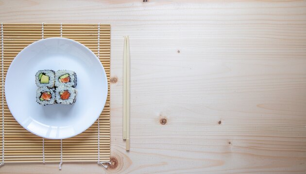 Four pieces of salmon avocado sushi on a plate with chopsticks. Perfect for food blogs, restaurant menus, or asian cuisinethemed designs. - Powered by Adobe