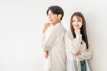 Young Asian couple standing back to back (marriage, dating, partner, DINKS, lover, romance)
