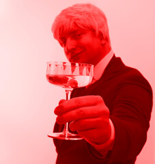 Photo of young handsome man happy positive smile drink alcohol. Man happy day. Cocktail. Drink. Lifestyle. Dream. 