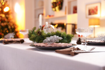 Festive table setting with Christmas decor indoors, closeup
