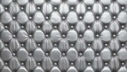 Elegant silver tufted texture, capturing a rich and luxurious feel. The arrangement of the buttons creates a stunning display of depth, form, and texture