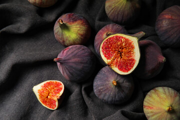 Fresh ripe figs on black napkin, closeup