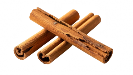 Three rolled cinnamon sticks crossed over each other, isolated on transparent background