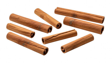 Several rolled cinnamon sticks scattered on a pure transparent background, a common aromatic spice ingredient