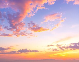 Fototapeta premium A vibrant sunset sky is painted with swirls of pink, orange, and purple clouds against a soft blue backdrop. Mountains are visible below