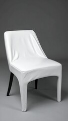 White Chair with Fabric Cover on Gray Background.