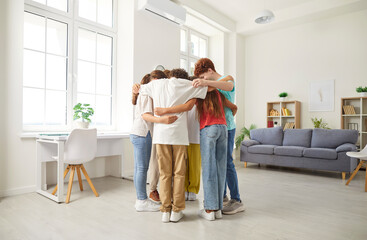 School children unity, young student friends and classmates girls and boys standing close together in common hug enjoy friendly environment, loving team communication, support, engagement in care 