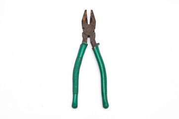 Old, rusty combination pliers (utility tool) with bright green rubber handles. Vintage work equipment in used and weathered condition. Maintenance, hardware, and construction concept. Isolated on whit