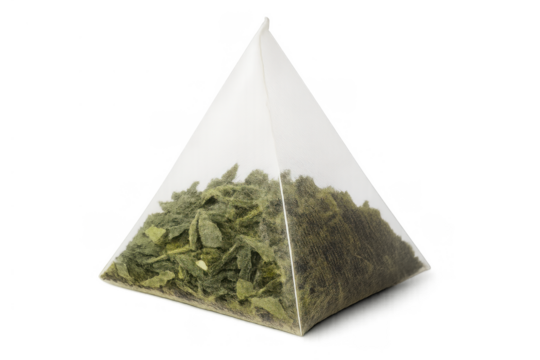 Green tea leaves in a transparent pyramid tea bag, highlighting natural beverage, healthy lifestyle, and preparing hot drink
