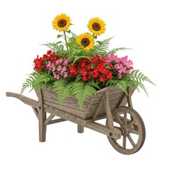 Rustic wooden wheelbarrow overflowing with vibrant sunflowers and colorful garden flowers isolated on white background