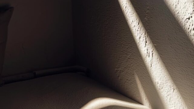 Abstract Light and Shadow Play on Textured Surface.