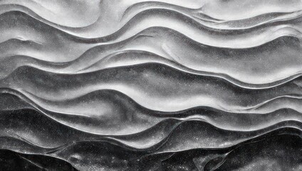 Fototapeta premium A close-up, monochromatic image showing fluid, undulating wave-like textures