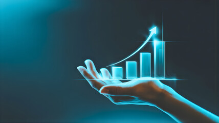 A futuristic concept of business development and financial success, with a hand holding a glowing digital bar graph showing an upward investment trend