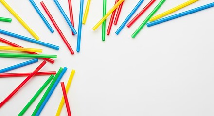A colorful array of plastic straws on a white background.