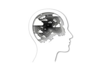 Paper cut style silhouette of a human head profile showing a swirling mind filled with clouds