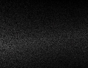 Fototapeta premium Dark, grainy texture background showing variations in light and shadow in an abstract way
