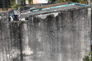 Old weathered cement wall with crack
