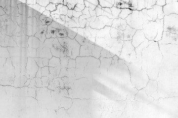 Fototapeta premium Aged cracked white wall with soft shadow texture