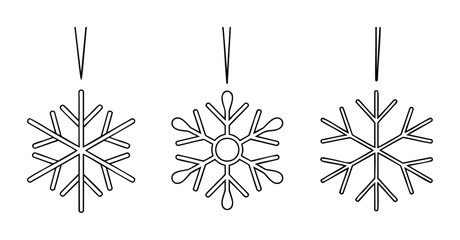 Set of three distinct snowflake outlines suggesting winter holidays and festive celebration themes for seasonal promotions and design projects.