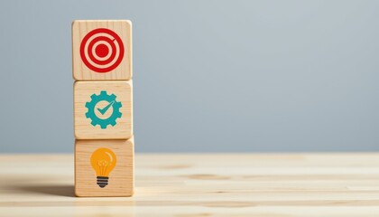 Colorful wooden blocks with target, gear, and light bulb icons representing success, innovation, and planning in business and education
