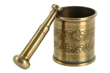 Antique brass mortar and pestle with intricate carvings isolated on transparent background