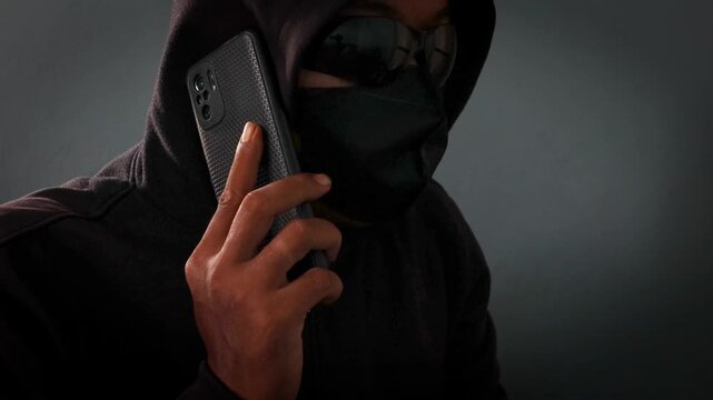 Phone Scammers, mysterious man with phone, cyber theft and fraud, mobile phone used for hacking, secret attacks on privacy