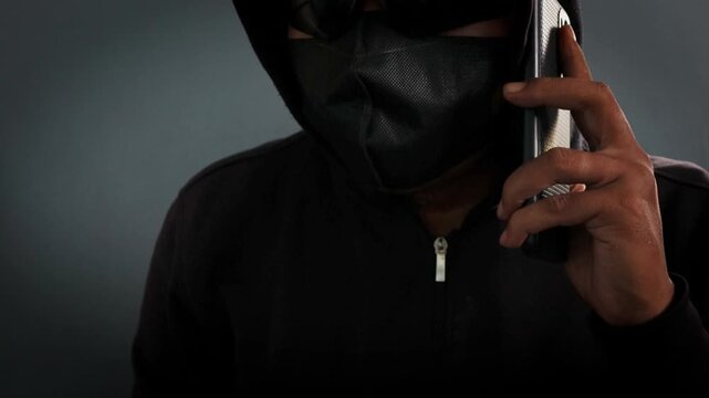 Phone Scammers, mysterious man with phone, cyber theft and fraud, mobile phone used for hacking, secret attacks on privacy