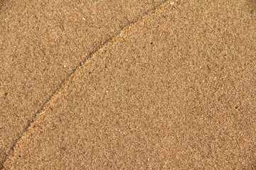 Beach sand texture background at the sea.